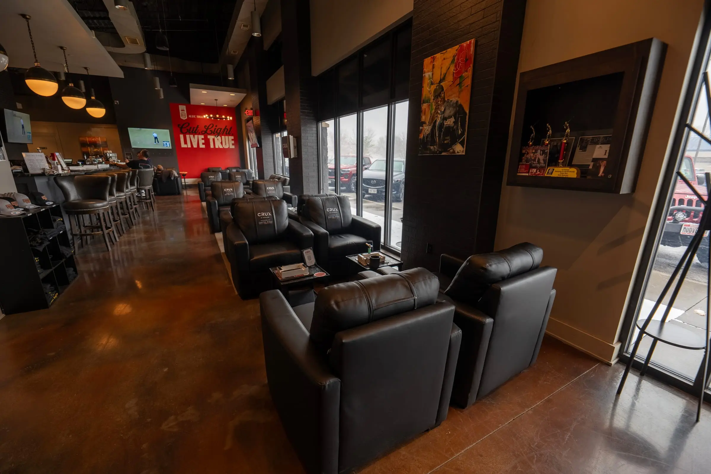 Warm, low-lit upscale lounge interior in Lincoln, Nebraska — the kind of formal room gala coverage has to handle