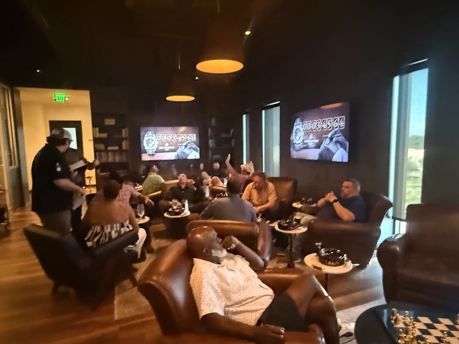 The competition room at Apiary Social Club with official timers running on the wall screens