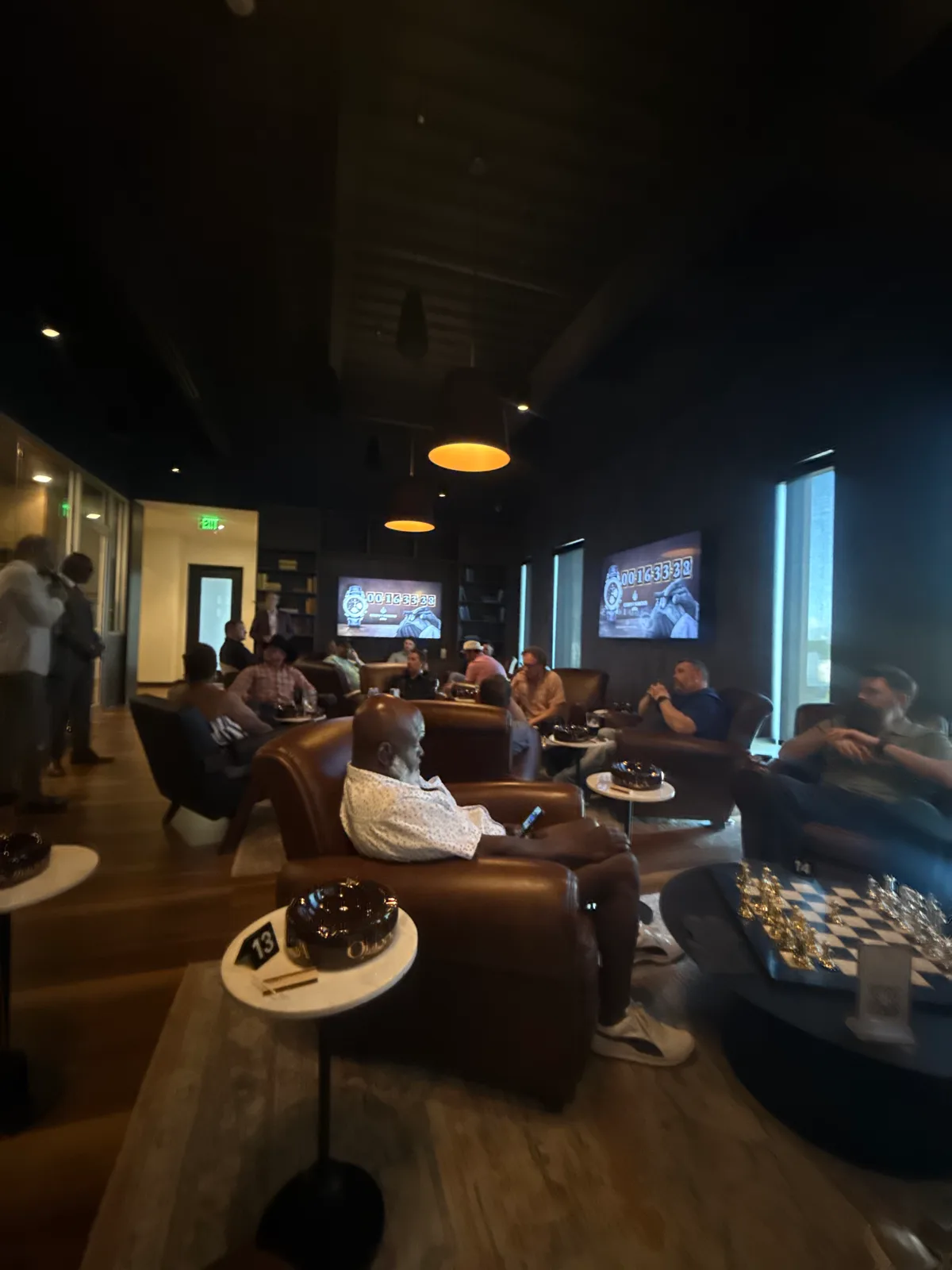 Competitors seated in leather armchairs during the CSWC Omaha qualifier, timer at 16 minutes